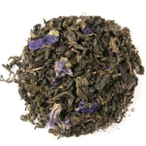 Loose tea leaves with purple flower petals.